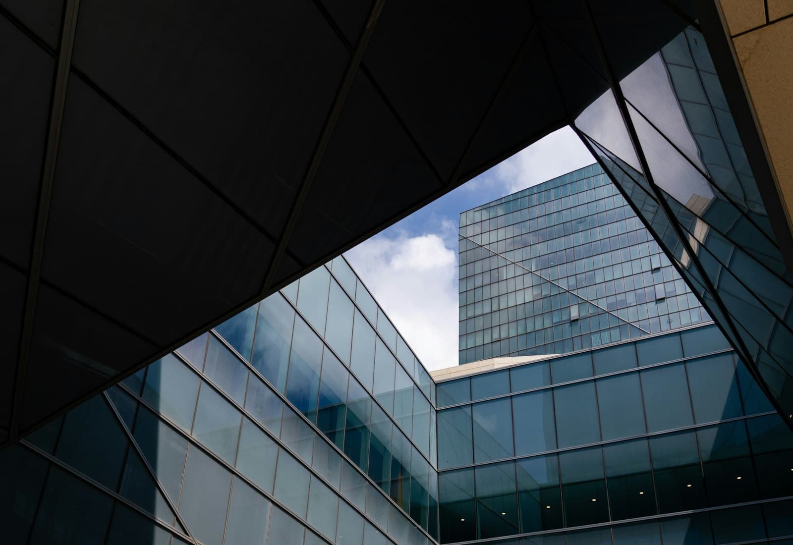 A tall office building seen through a window